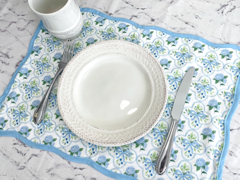 placemat with blue flowers and blue border