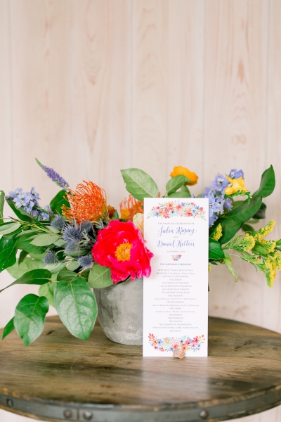 wedding invitation in front of flowers
